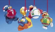 Kurt Adler holding christmas balls