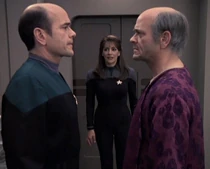 Deanna Troi with the Doctor and Lewis Zimmerman