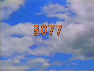 3077