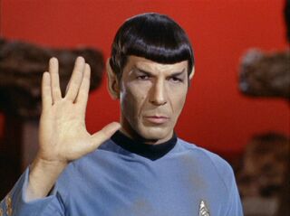 Commander Spock giving the Vulcan salute.