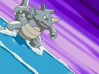 EP519 Rhydon usando surf