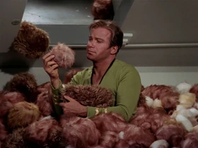Kirk surrounded by Tribbles