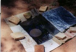Hole in the ground box cooker built by Kristen Rahn