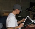 Eminem signing autographs