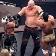 Kane choking Rey and Alberto