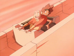 Young Bumi and Aang sliding