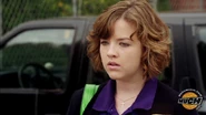 Clare In Her Degrassi Uniform Looking At Eli With A Concerned Look On Her Face