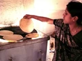 Barli Institute student making chapatis in the Scheffler kitchen.jpg