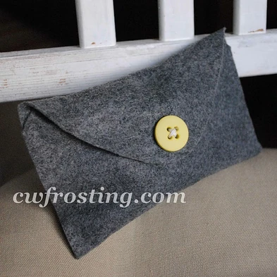 http://www.cwfrosting.com/2011/06/no-sew-buttoned-felt-envelope