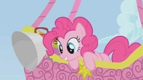 Pinkie Pie looks at Spike who is climbing the rope S1E13
