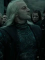 Lucius with tattooed prisoner number.jpg