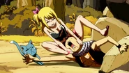 Natsu being pulled out of a boulder