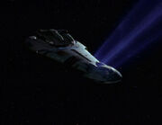 Ktarian starship in tractor beam