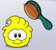 Yellow puffle being brushed