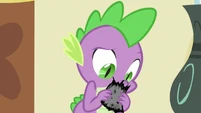 Spike reading the remains of newspaper S2E23