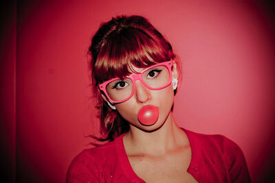 Bella with glasses and bubblegum