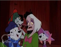 Dogs and Cruella in costume