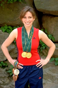 Shannon Miller with medals in gym outfit