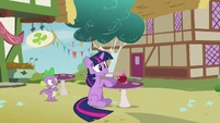 Twilight sat on the floor by the table S3E3