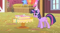 Twilight looks at Pinkie's birthday cake S1E25