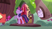 Twilight smiling with her hoof raised S3E13