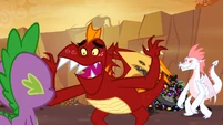 Garble accuses Spike of being a pony in a dragon costume S2E21