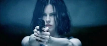 Selene firing a USP Compact in the shooting range