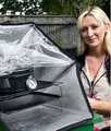 Kate Rowland with Sunflair solar oven.jpg