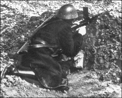 A Hlinka Guard armed with a ZB vz. 26 light machinegun in action at Kolonica, November 12, 1938.