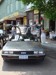A De Lorean at a car show in 2005 with OUTATYM licence plate similar to the OUTATIME license plate in Back to the Future.