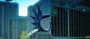 The (blue) Spined Shark on its circular stone fountain base