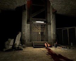 The elevator's empty shaft, before the battle in the dark.