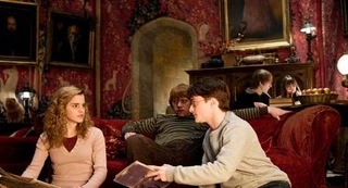 Hermione, Harry, and Ron in Gryffindor Tower in their sixth year.