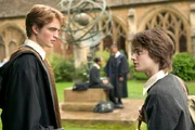 Cedric is told about the dragons for the First Task by Harry.