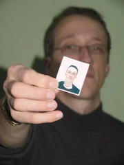 Whitby holding his original passport photo