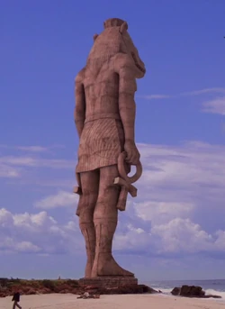 "What lies in the shadow of the statue?"