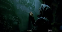 Ms. Hawking writes out several equations on a chalkboard.