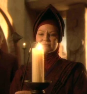 Vedek Winn Adami with a candle.