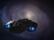 The Defiant in front of the Bajoran wormhole and a subspace inversion of it