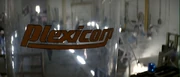 The Plexicorp logo overlooking the factory floor.