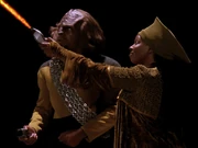 With ease, Guinan defeats Worf on the phaser range