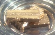 Three strips of gold-pressed latinum