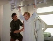 An Ocampan woman giving birth standing