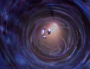 The fragments of the Sword of Stars emerge from the wormhole.