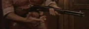 A Winchester rifle being cocked