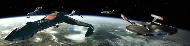 Fleet Admiral Krell's fleet, alongside Enterprise (NX-01) and Columbia (NX-02), in orbit over the Qu'Vat colony in 2154. (ENT: "Divergence")
