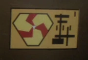 The Triskelion logo on a cargo crate in the 24th century.