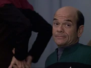The Doctor rubs Janeway's backside