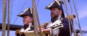 Captain Picard en Commander Riker vieren de promotie van Worf in een holodek.