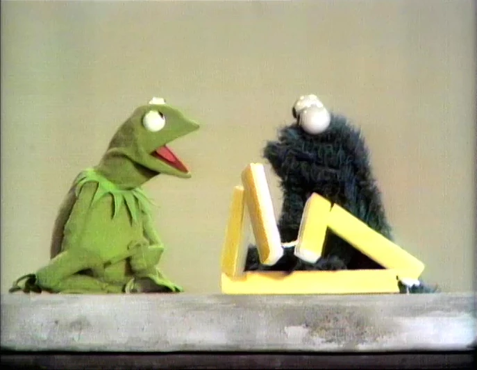 Kermit the Frog and Cookie Monster.